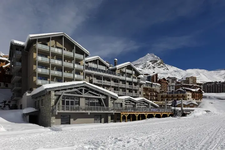Hotel Marielle in Val Thorens, its stone and timber facade below the slopes