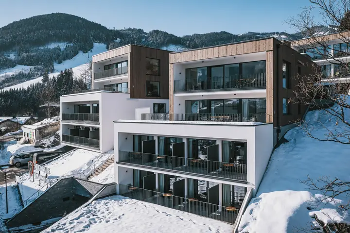 Nikolaus by AvenidA Panoramic Wellness Suites in Zell am See, with balconies facing the snow-covered valley