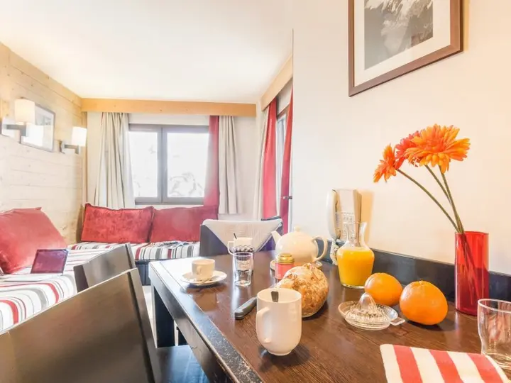 Studio with sleeping alcove at Residence Saskia Falaise, with a kitchen table set for breakfast
