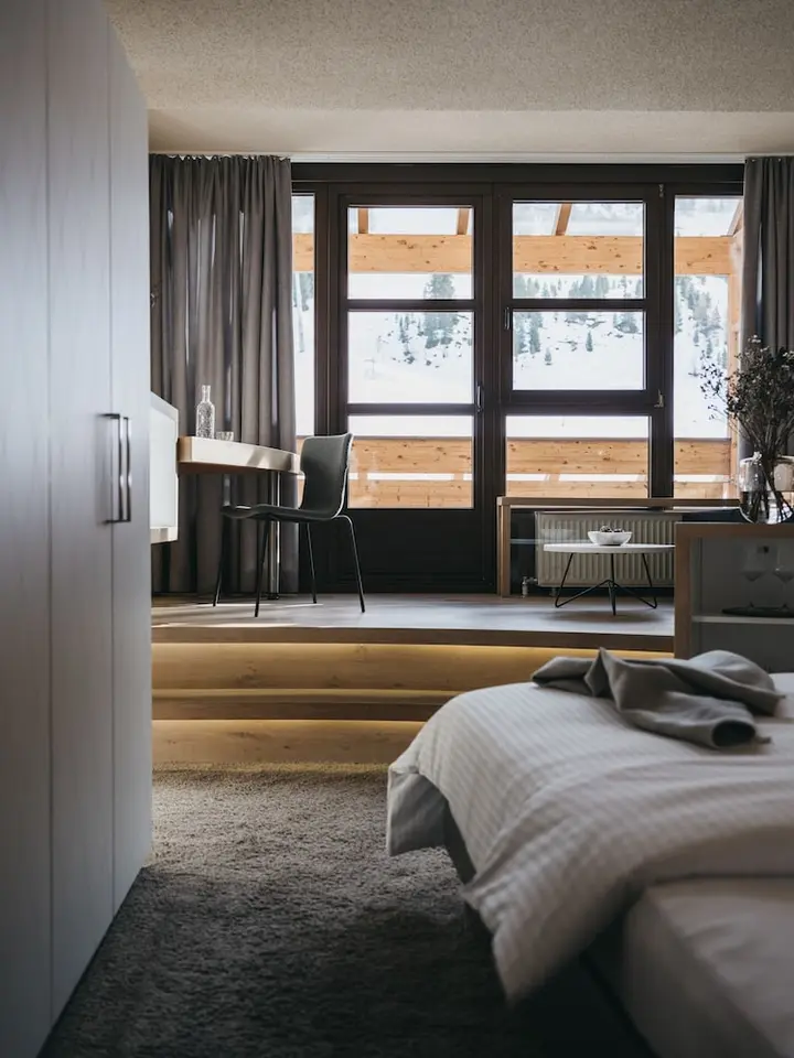 Superior Room at The Crystal Vaya Unique, with a desk and window onto the snow