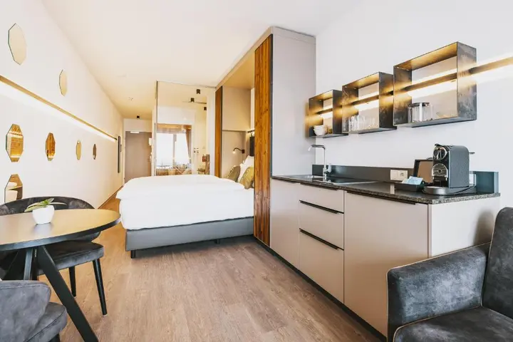 Superior double room with sauna at Nikolaus by AvenidA, with a kitchenette and seating area